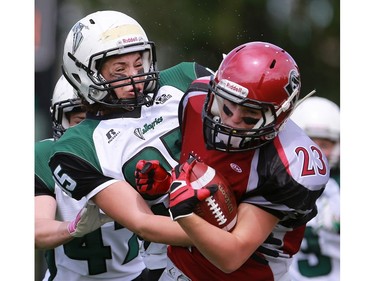 Valkyries' Danielle Haughian tackles Riot's Carmen Agar during first half action at the Saskatoon Valkyries vs. Regina Riot conference final at SMF Field in Saskatoon, June 19, 2016.