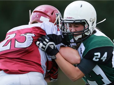 Valkyries' Ehjae Chan tackles Riot's Carmen Agar during first half action at the Saskatoon Valkyries vs. Regina Riot conference final at SMF Field in Saskatoon, June 19, 2016.