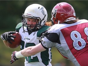 Valkyries' Samantha Matheson dodges Riot's Morgan Wilson during first half action at the Saskatoon Valkyries vs. Regina Riot conference final at SMF Field in Saskatoon, June 19, 2016.