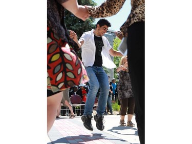 Abdullah Seif Aldeen celebrates World Refugee Day put on by the Saskatoon Refugee Coalition at Civic Square at City Hall in Saskatoon on June 20, 2016.