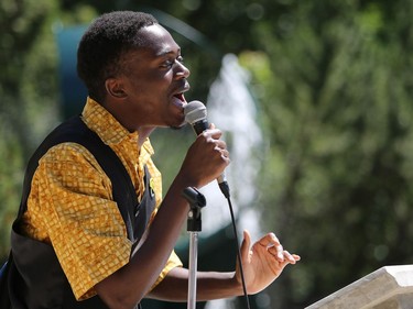 Elisha Muembo sings during World Refugee Day put on by the Saskatoon Refugee Coalition at Civic Square at City Hall in Saskatoon on June 20, 2016.