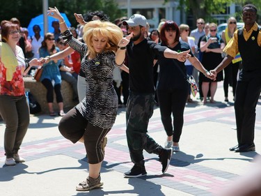 The crowd came together to dance during World Refugee Day put on by the Saskatoon Refugee Coalition at Civic Square at City Hall in Saskatoon on June 20, 2016.
