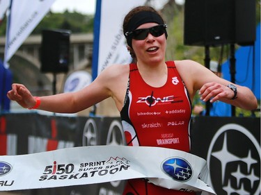 Christina Charles is the first woman to cross the finish line at the Subaru 5i50 Saskatoon Triathlon on June 26, 2016. She came in sixth overall.