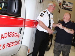 Bryan Manson receives the keys to the new ambulance donated to the town of Radisson in honour of his son, Ethan, who died in an accident last year.