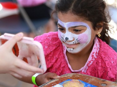 Nisrin Khalyan gets her face painted during the PotashCorp Children's Festival at Kiwanis Park Sunday in Saskatoon.