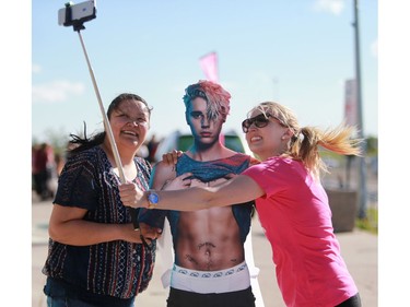 Rosalie Settee and Sarah Ouellet take a selfie with a Justin Bieber cutout at the Justin Bieber concert at SaskTel Centre in Saskatoon on June 16, 2016.