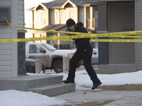 Police investigate shooting at unit 602 1015 Patrick Crescent in Willowgrove on January 26, 2015.
