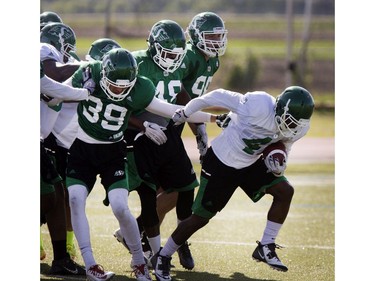 Running back Johnta Hebert runs the ball during Roughrider spring camp in Saskatoon, June 1, 2016.