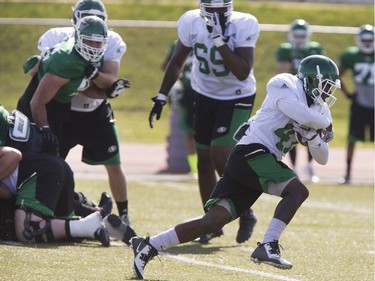 Running back Johnta Hebert runs the ball during Roughrider spring camp in Saskatoon, June 1, 2016.