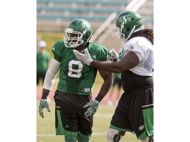 Shawn Lemon, defensive lineman at left, with Xavier Fulton, offensive lineman in Rider camp action at Griffiths Stadium in Saskatoon, Thursday, June 02, 2016.