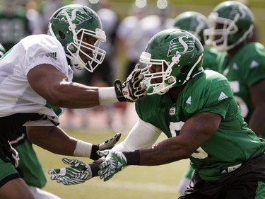Shawn Lemon, defensive lineman, right, in action at Rider camp action at Griffiths Stadium in Saskatoon, Thursday, June 02, 2016.
