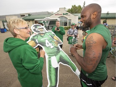 Donna Stewart from Grande Prairie, AB gets an autograph from the real Darian Durant, quarterback, during Rider training camp at Griffiths Stadium in Saskatoon, Friday, June 03, 2016.