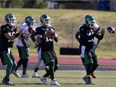 L-R: Quarterbacks Brett Smith, B.J. Coleman and Phillip Simms during Roughrider training camp at Griffiths Stadium, June 13, 2016.