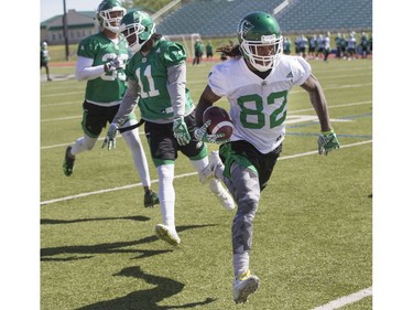 Wide receiver Naaman Roosevelt outruns defensive back Ed Gainey during Roughrider training camp at Griffiths Stadium, June 15, 2016.