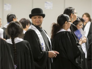 About 200 grads took part in convocation ceremonies for the Saskatchewan Indian Institute of Technologies at Prairieland Park, June 16, 2016. Backstage the grads had their photos taken and were instructed in the procession.