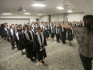 About 200 grads took part in convocation ceremonies for the Saskatchewan Indian Institute of Technologies at Prairieland Park, June 16, 2016. Backstage the grads had their photos taken and were instructed in the procession.