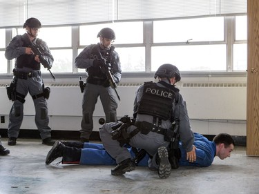 Members of the Saskatoon Police Service’s Tactical Support Unit enact a takedown during a media presentation on June 28, 2016. Police say the TSU is responding to an increasing number of high-risk and violent incidents.