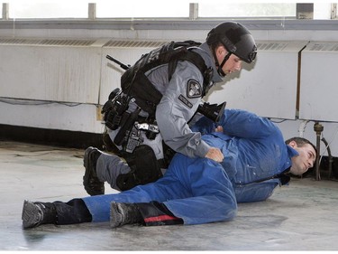 Members of the Saskatoon Police Service’s Tactical Support Unit enact a takedown during a media presentation on June 28, 2016. Police say the TSU is responding to an increasing number of high-risk and violent incidents.