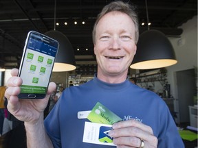 Affinity Credit Union CEO Mark Lane shows off the Android Mobile Pay technology developed by four Canadian credit unions and now available in Saskatchewan.