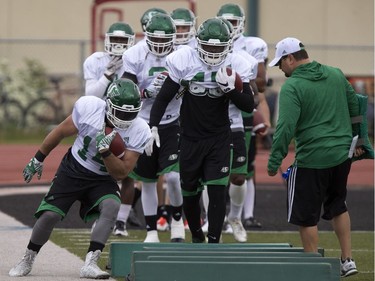 Running back #14 Matt Walter in running drill during Roughrider camp at Griffiths Stadium, May 31, 2016.