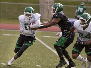 Wide receiver Ryan Lankford takes a handoff from quarterback Darian Durant in action during Roughrider camp at Griffiths Stadium, May 31, 2016.