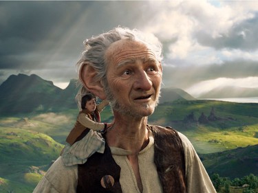 Ruby Barnhill (L) and the Big Friendly Giant from Giant Country, voiced by  Mark Rylance, in "The BFG."