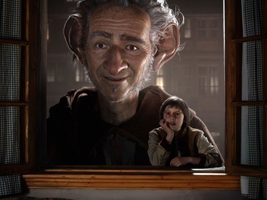 Ruby Barnhill (R) and the Big Friendly Giant from Giant Country, voiced by  Mark Rylance, in "The BFG."