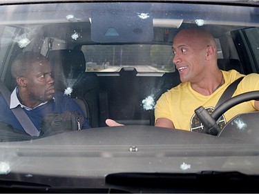 Kevin Hart (L) and Dwayne Johnson star in "Central Intelligence."