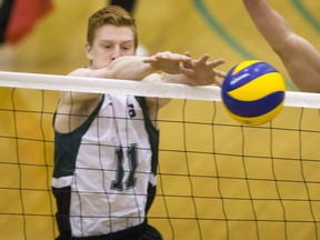 University of Saskatchewan Huskies setter CJ Gavlas attempts to block a shot against the University of Regina Cougars in CIS Men's Volleyball action on Saturday, February 20th, 2016.