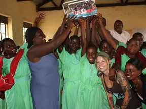 University of Saskatchewan veterinary medicine student Sarah Zelinski (bottom right) is pictured with students at Kihwa Primary School in Uganda where she taught them how to sew reusable menstrual pads. (Provided photo)