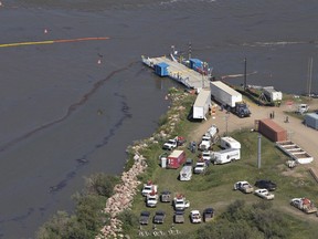 Crews work to clean up an oil spill on the North Saskatchewan river near Maidstone.