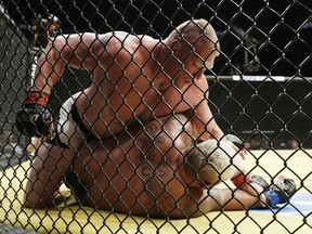 Brock Lesnar, top, fights Mark Hunt at UFC 200, on July 9, 2016, in Las Vegas.