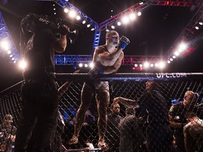 Eddie Alvarez celebrates after defeating Rafael Dos Anjos during their lightweight championship fight at UFC Fight Night 90 at the MGM Grand Garden Arena on Thursday, July 7, 2016, in Las Vegas. Alvarez defeated Dos Anjos by first round TKO. (Benjamin Hager/Las Vegas Review-Journal via AP) ORG XMIT: NVLAS106