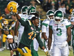 The Edmonton Eskimos' Odell Willis, 41, celebrates his team's 39-36 overtime victory over the visiting Saskatchewan Roughriders on Friday.