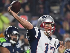 This file photo taken on February 1, 2015 shows quarterback Tom Brady of the New England Patriots passing against the Seattle Seahawks during Super Bowl XLIX at the University of Phoenix Stadium in Glendale, Arizona.