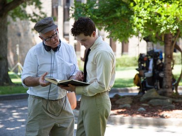 Director James Schamus (L) and actor Logan Lerman on the set of "Indignation."