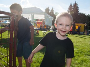 Malachi Grenier, 2, of Saskatoon is delighted with the petting zoo at Saskatoon Ribfest in Diefenbaker Park on July 29, 2016.