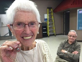 Marguerite Brookbank, shown with husband Ken, displays the replica Stanley Cup ring she wears around her neck during a recent visit to the StarPhoenix.
