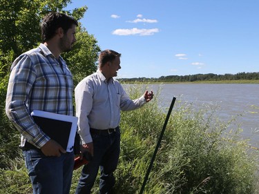 Jeff Da Silva, public works manager for Prince Albert, (L) checks up on the work in progress at the Prince Albert water treatment plant on July 25, 2016.