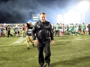 A drenched Chris Jones walks off the field at Mosaic Stadium on Friday night after registering his first victory as the Saskatchewan Roughriders' head coach, general manager and vice-president of football operations.