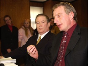 Robert Borden, left, says one of the traumatizing cases that led to a gambling problem was when he represented members of the Klassen and Kvello families in their wrongful prosecution lawsuit. He's pictured here in a 2003 file photo with Richard Klassen at a news conference on the success of their lawsuit.