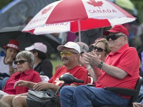 Thousands enjoy the Canada Day festivities, cultural entertainment on a stage,  Canada Day cup cakes, food trucks, bouncing toys for kids and displays spread out over Deifenbaker Park in Saskatoon,  July 1, 2016.