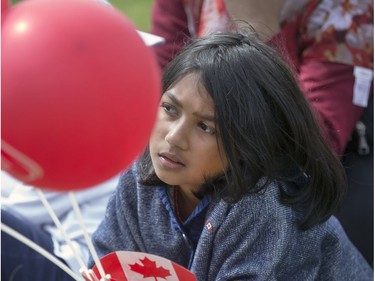 Thousands enjoy the Canada Day festivities and the reaffirmation of their citizenship, cultural entertainment on a stage,  Canada Day cup cakes, food trucks, bouncing toys for kids and  displays spread out over Diefenbaker Park in Saskatoon,  July 1, 2016.