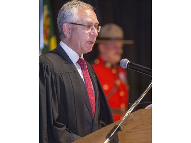 Officer of the Order of Canada Arnold Boldt speaks to the 70 new Canadians before explaining how the ceremony to officially become a Canadian will take place in Saskatoon at the Western Development Museum on Canada Day, July 1, 2016.