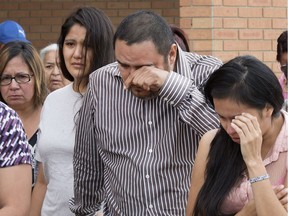 Jeffery Longman, grandfather to six-week-old Nikosis Jace Cantre, gathers with family members outside Saskatoon provincial court on July 5, 2016. A 16-year-old girl is charged with second-degree murder in the death of Cantre on July 3. (GORD WALDNER/Saskatoon StarPhoenix)
