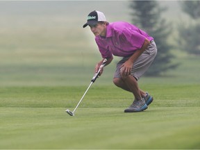 SASKATOON, SASK. JUNE. 29, 2015-Brett Henry lines up a putt during the Central Amateur golf tournament at the Saskatoon Golf and Country Club on June 29, 2015 in Saskatoon. {RICHARD MARJAN/The StarPhoenix}