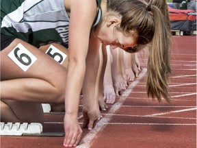 Runners take their mark during the senior girls 60-metre race at the Saskatoon high school track and field championships at Griffiths Stadium on May 25.