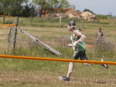 A competitor runs to the finish line while attempting to complete the 5K Foam Fest run near Pike Lake on Saturday, July 2nd, 2016.