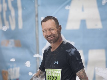 Wayne Nelson is all smiles after completing the 5K Foam Fest run near Pike Lake, July 2, 2016.