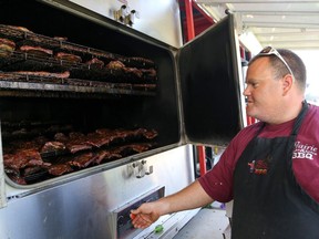 Rob Reinhardt and his crew from Prairie Smoke and Spice will return to Saskatoon Ribfest this year, slinging Rob's own secret weapon — Blue Ribbin' barbecue sauce.